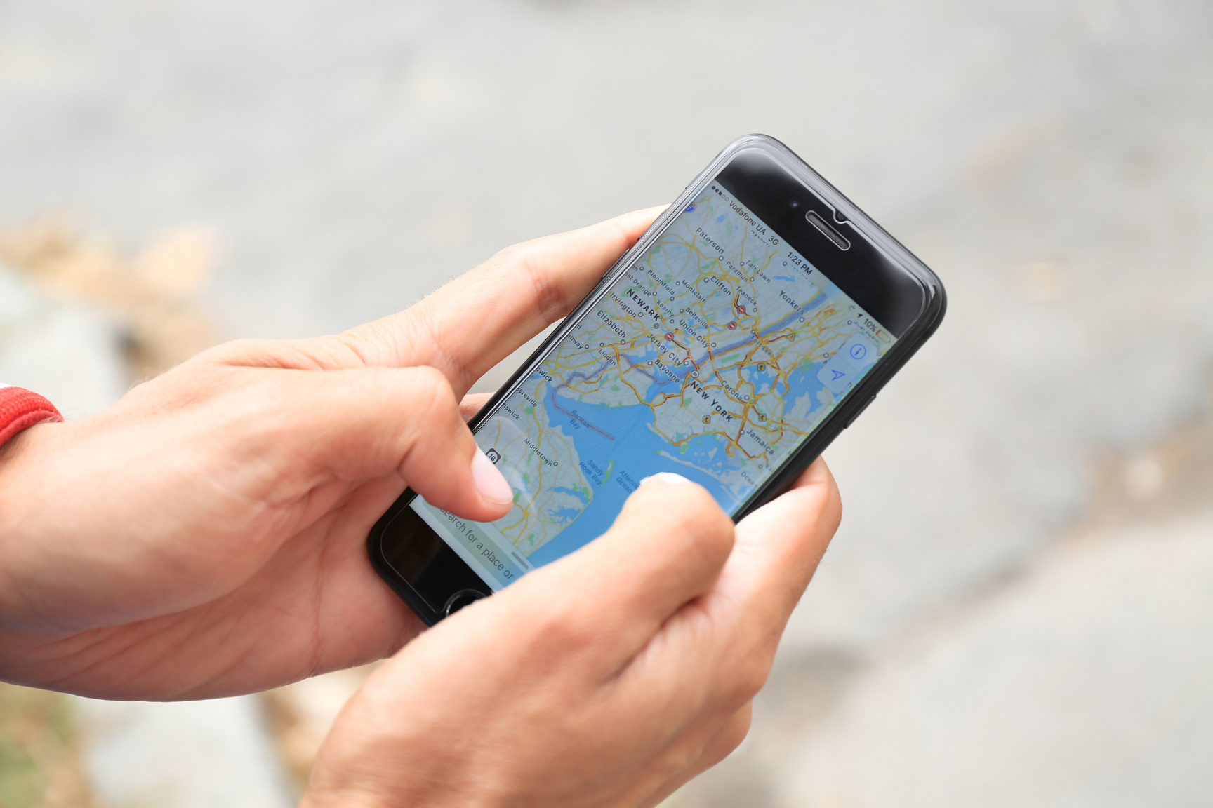 Man Using Maps Through a Mobile Phone